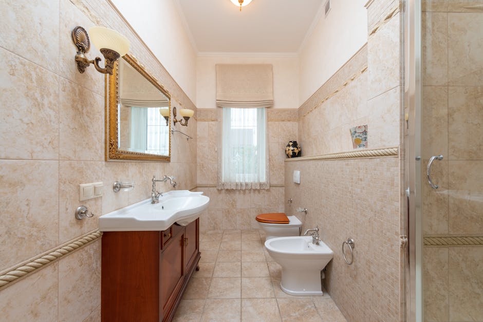 Classic style bathroom with elegant fixtures and neutral tones.