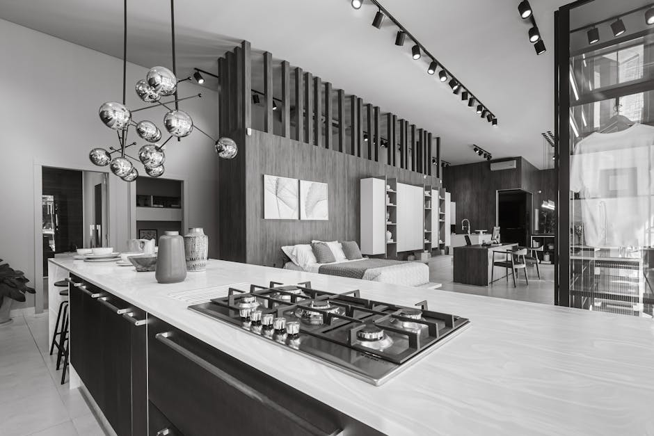 A sleek, modern open-concept kitchen and living area with stylish decor.