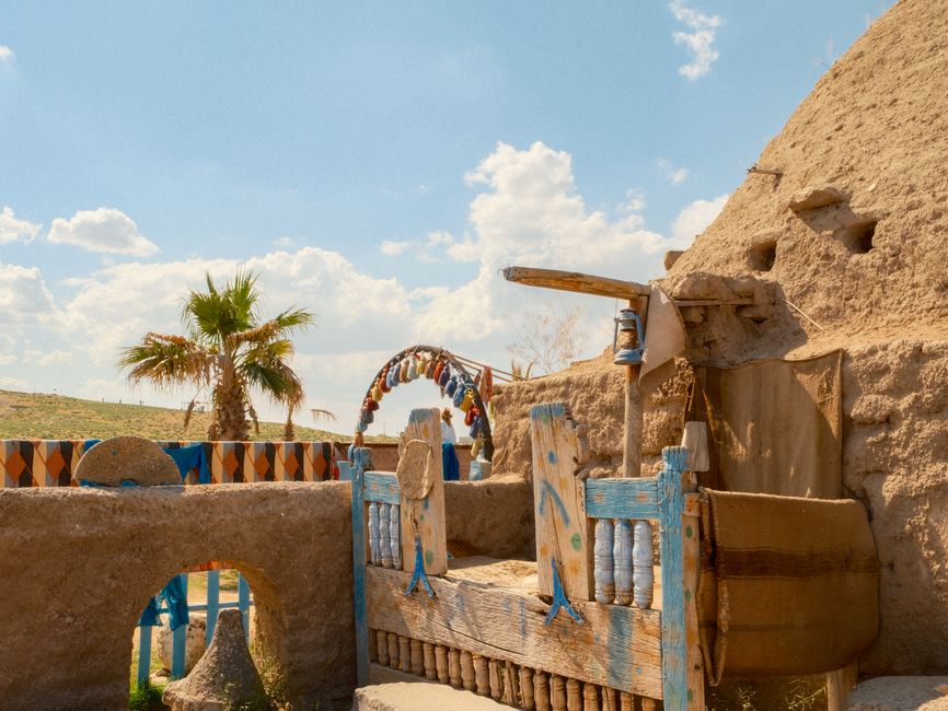 Explore the unique architecture of Harran's historic beehive houses under a bright summer sky.