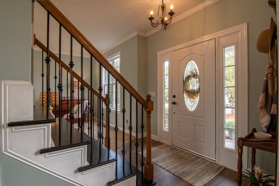 Inviting modern hallway with staircase and natural daylight