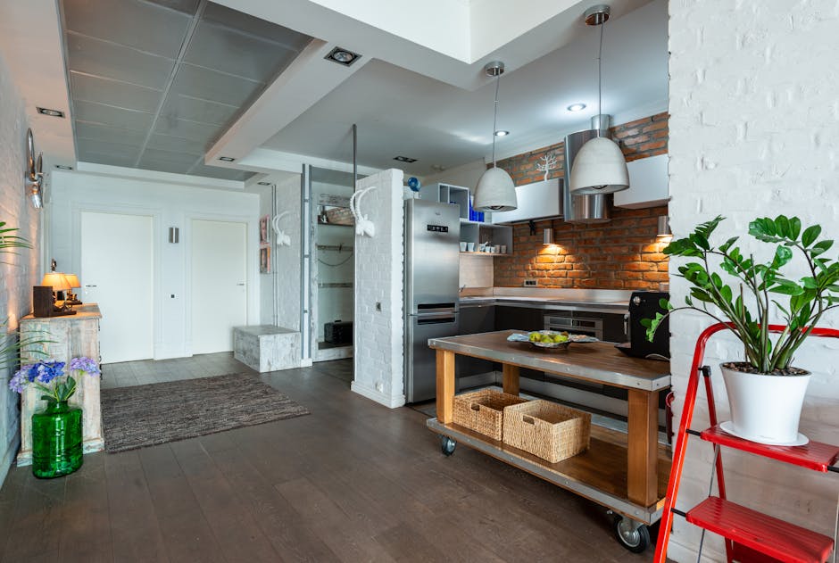 Stylish kitchen featuring brick walls, stainless steel appliances, and indoor plants.